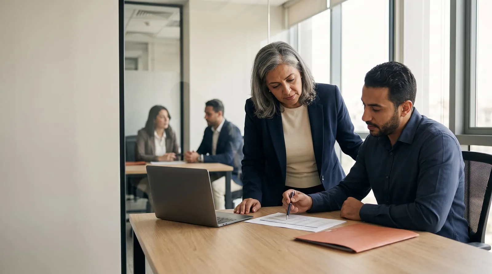 Senior consultant coaching a key account manager through an account plan